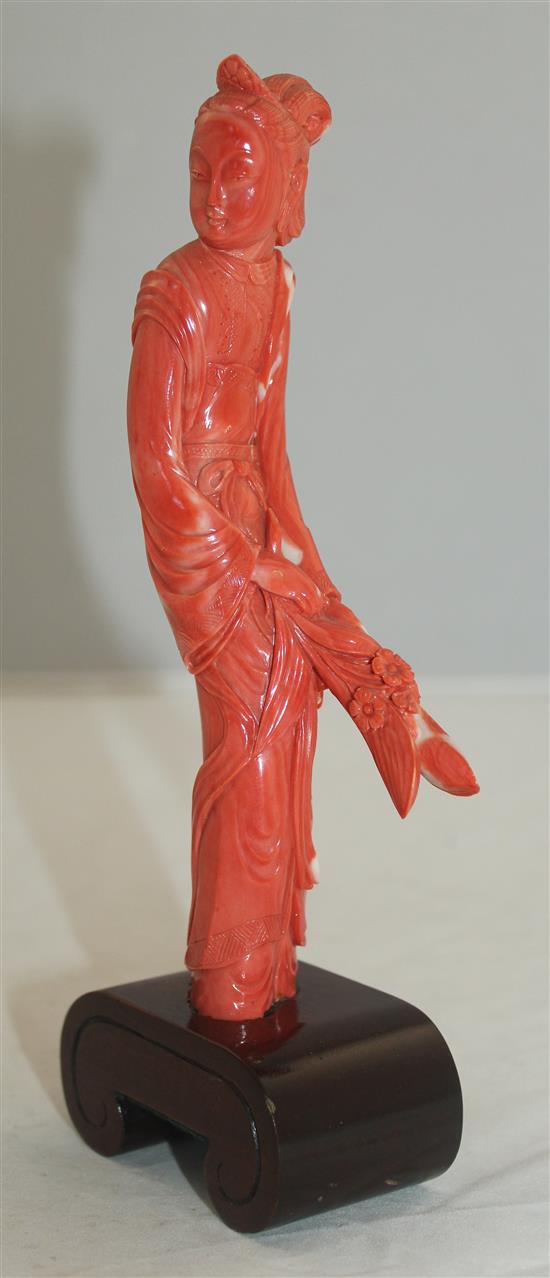 A Chinese coral figure of a beautiful lady, 20cm incl. wood stand
